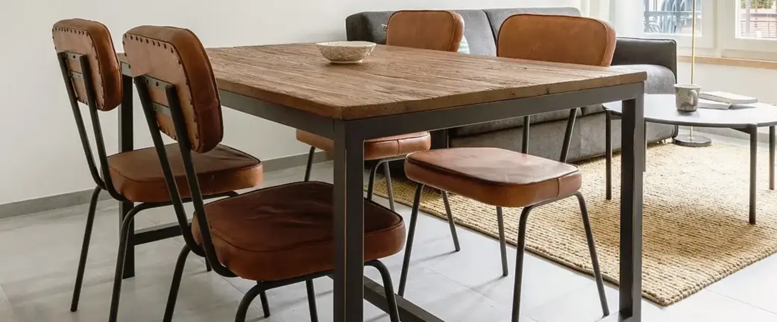 a dining table and chairs in a room