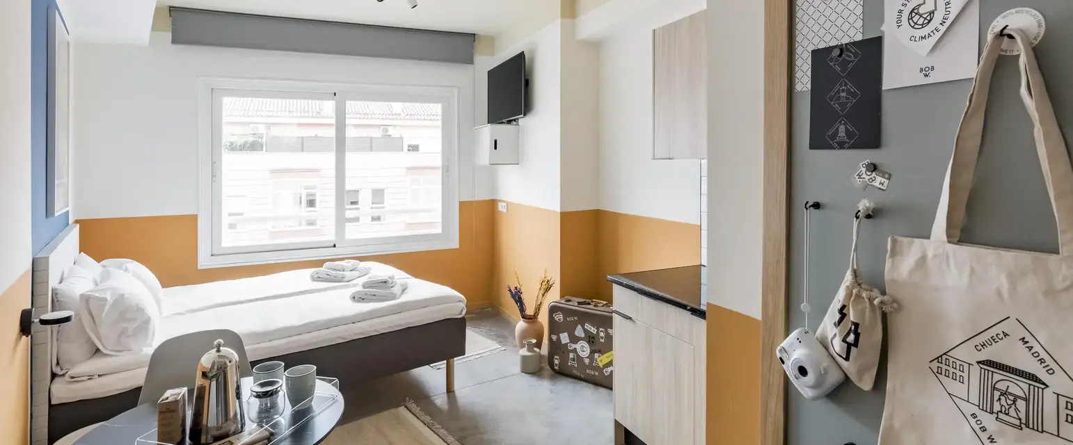 a room with a bed and a window