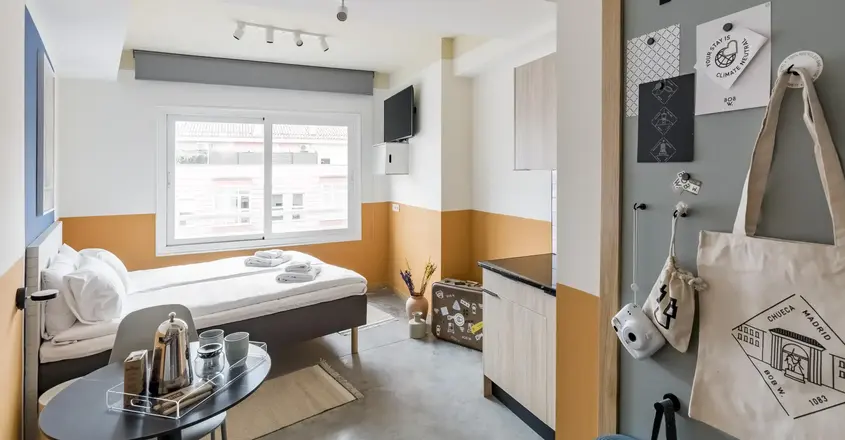 a room with a bed and a window