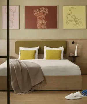 a person cleaning a bed