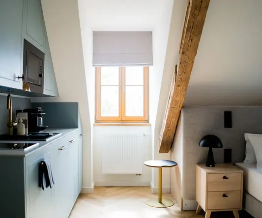 a kitchen with a table and a window