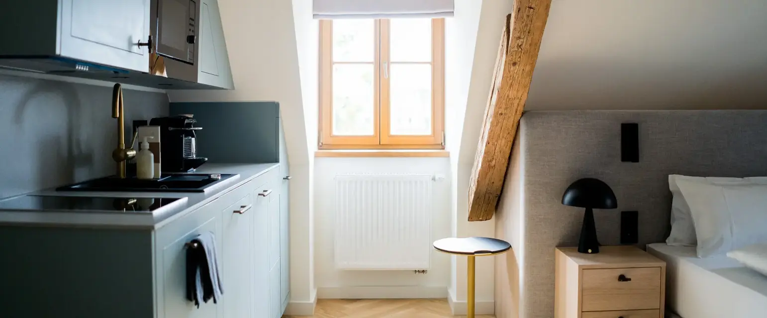 a kitchen with a table and a window