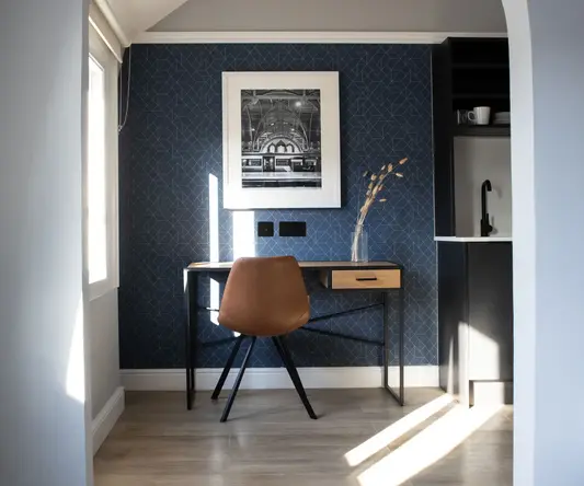 a desk and chair in a room