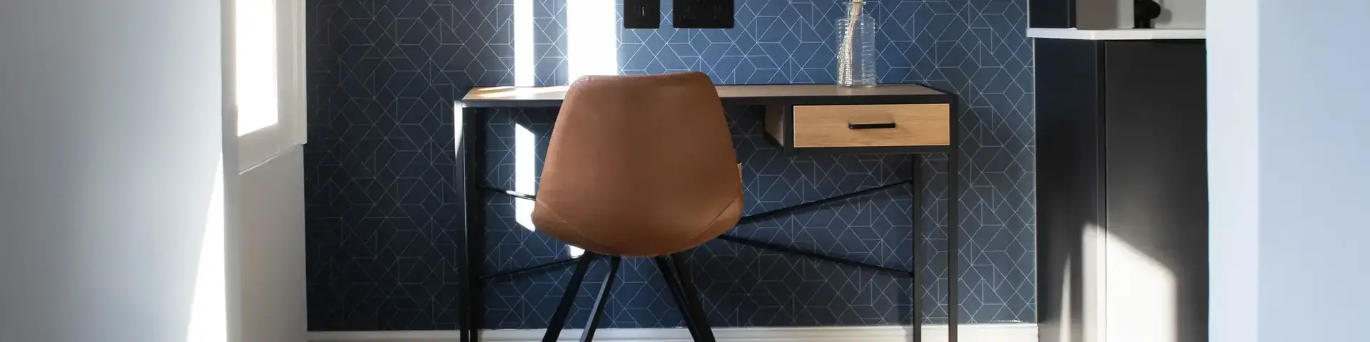 a desk and chair in a room
