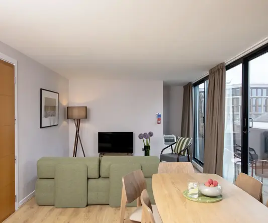 a living room with a couch and a table