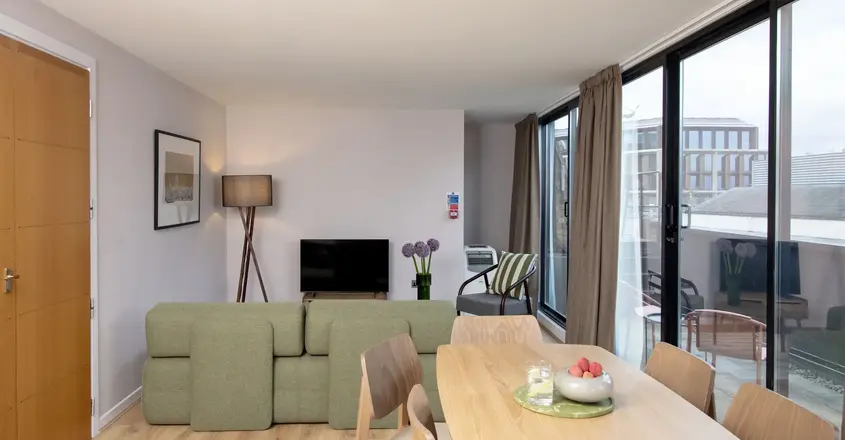 a living room with a couch and a table