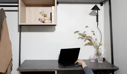 a person using a laptop on a desk