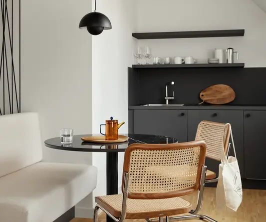 a room with a table and chairs