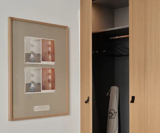 a picture of a closet and a picture of a clothes on the wall