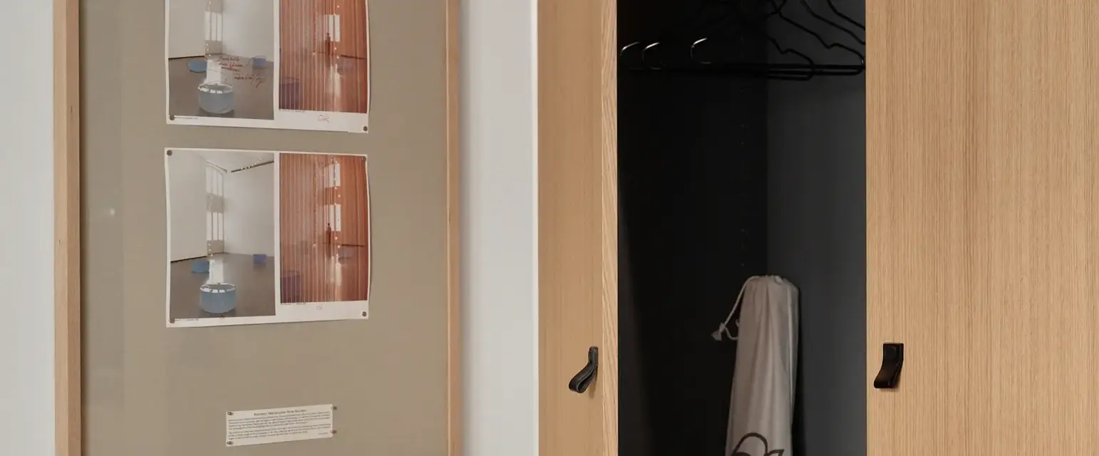 a picture of a closet and a picture of a clothes on the wall