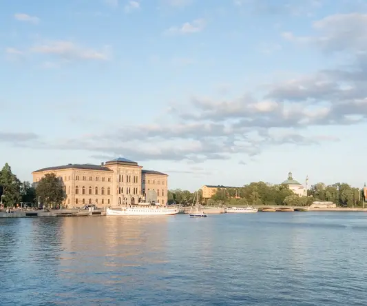 a body of water with buildings and boats