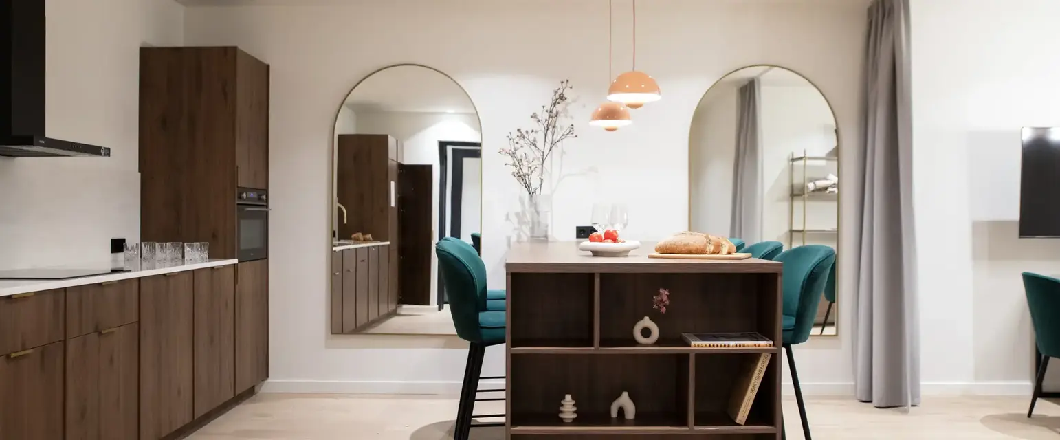 a dining room with a table and chairs