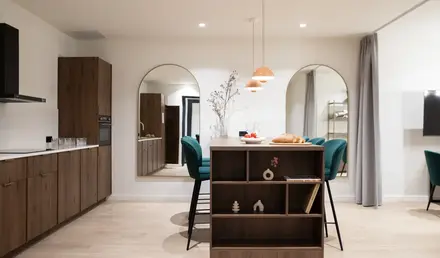 a dining room with a table and chairs