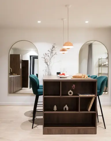 a dining room with a table and chairs