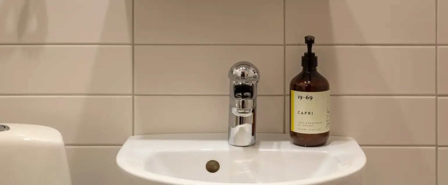 a bathroom with a mirror and a sink
