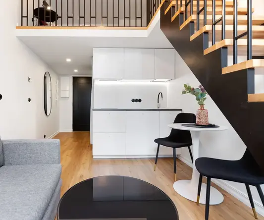 a living room with a sofa and a table