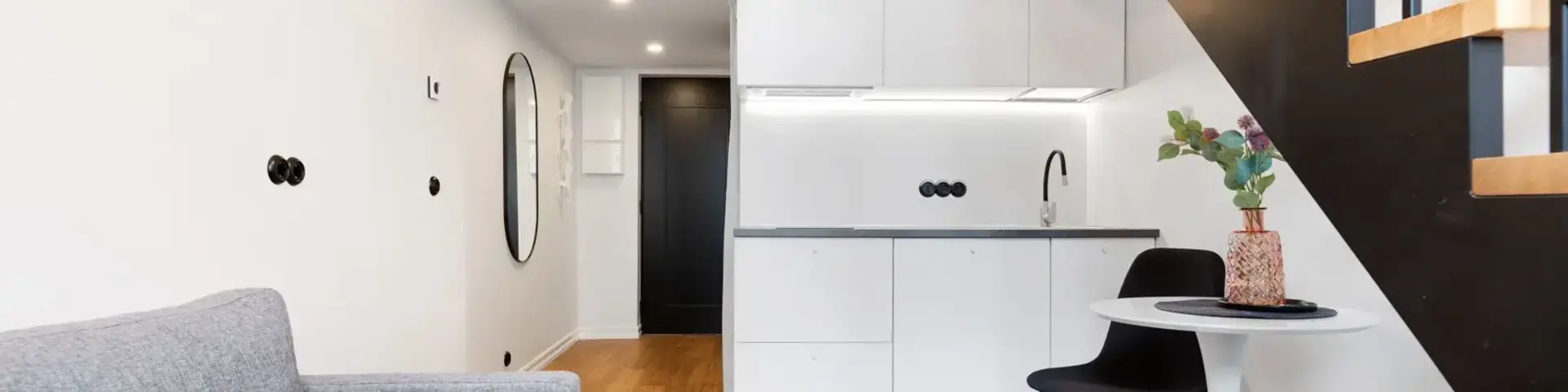 a living room with a sofa and a table