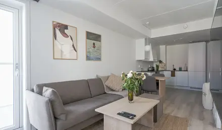 a living room with a couch and a table