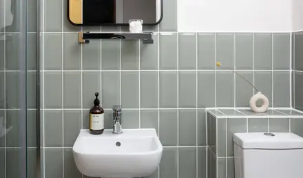 a bathroom with a mirror and sink
