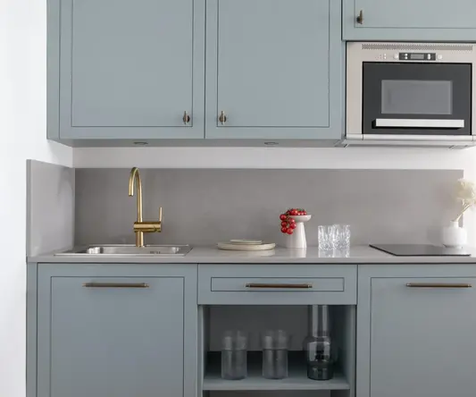 a kitchen with a sink and a microwave