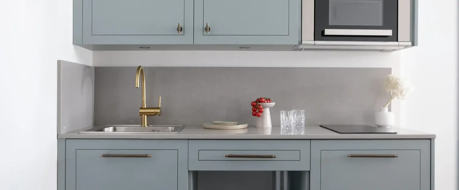 a kitchen with a sink and a microwave