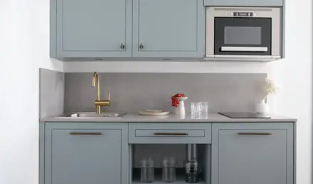 a kitchen with a sink and a microwave
