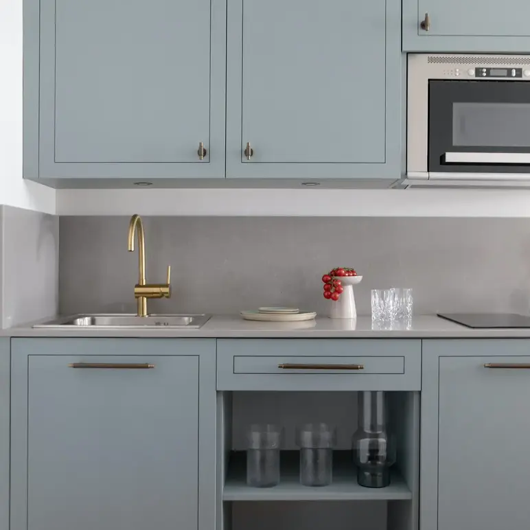 a kitchen with a sink and a microwave