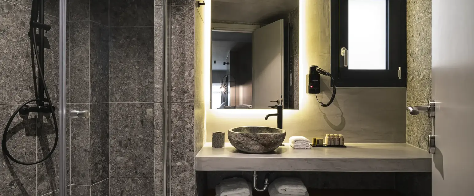 a bathroom with a sink and a shower