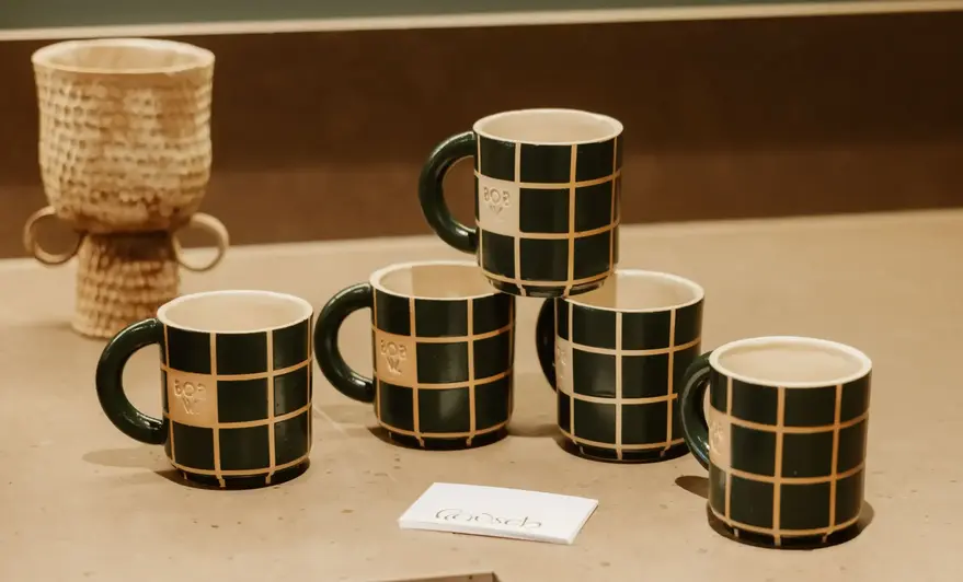 a group of coffee mugs on a counter
