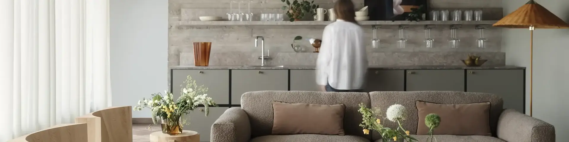 a living room with a couch and chairs