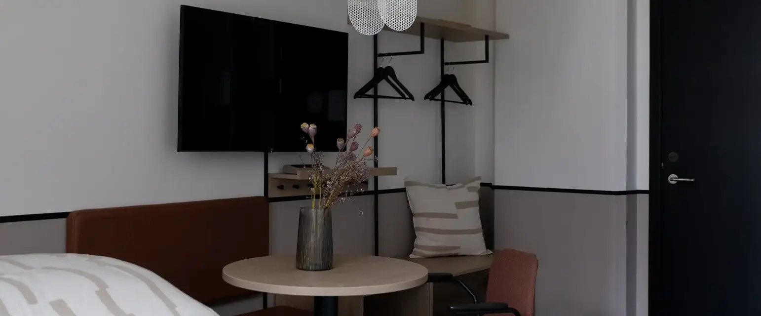 a room with a table and chairs