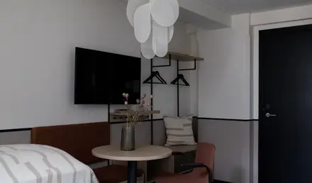 a room with a table and chairs