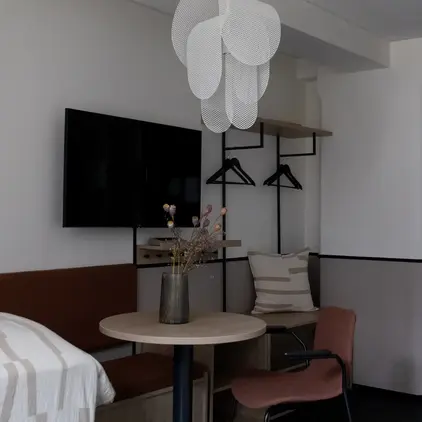 a room with a table and chairs