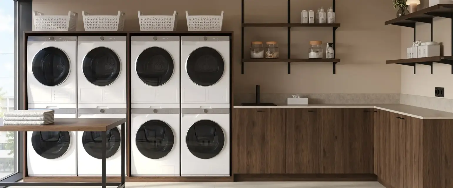 a laundry room with white and black washing machines