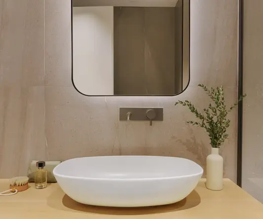 a sink and a mirror in a bathroom