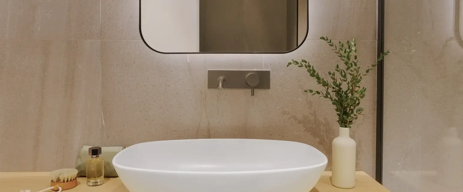 a sink and a mirror in a bathroom