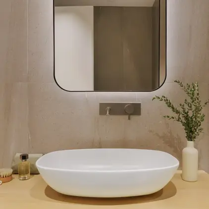 a sink and a mirror in a bathroom