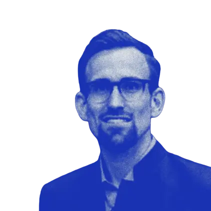 a man wearing glasses and a suit