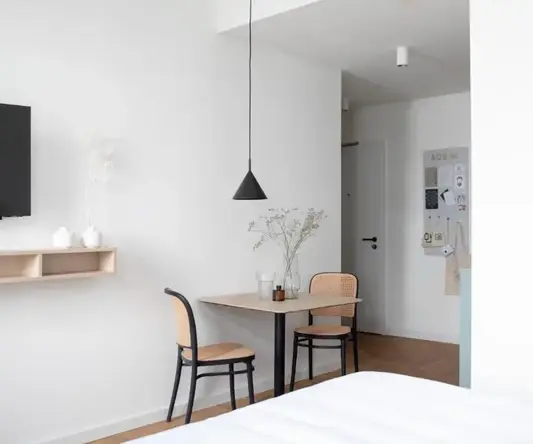 a room with a table and chairs