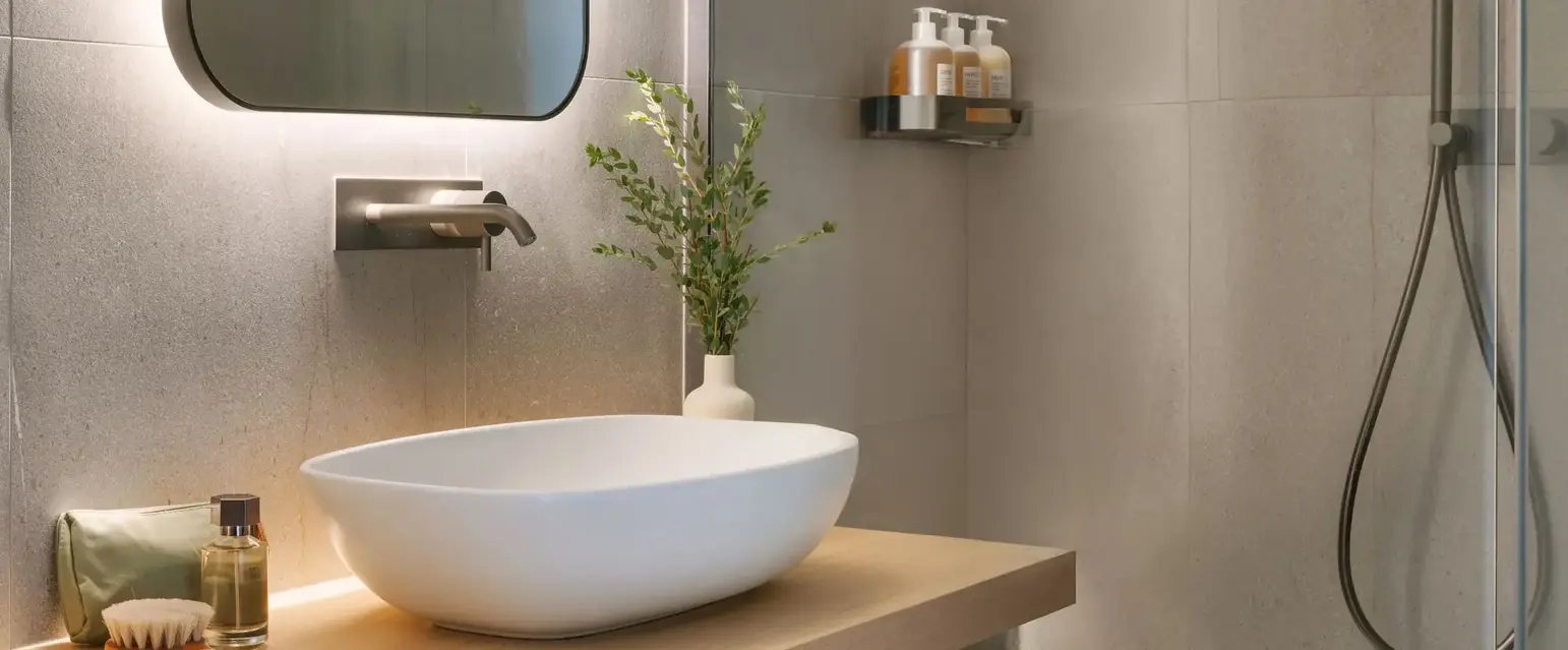 a bathroom with a sink and shower