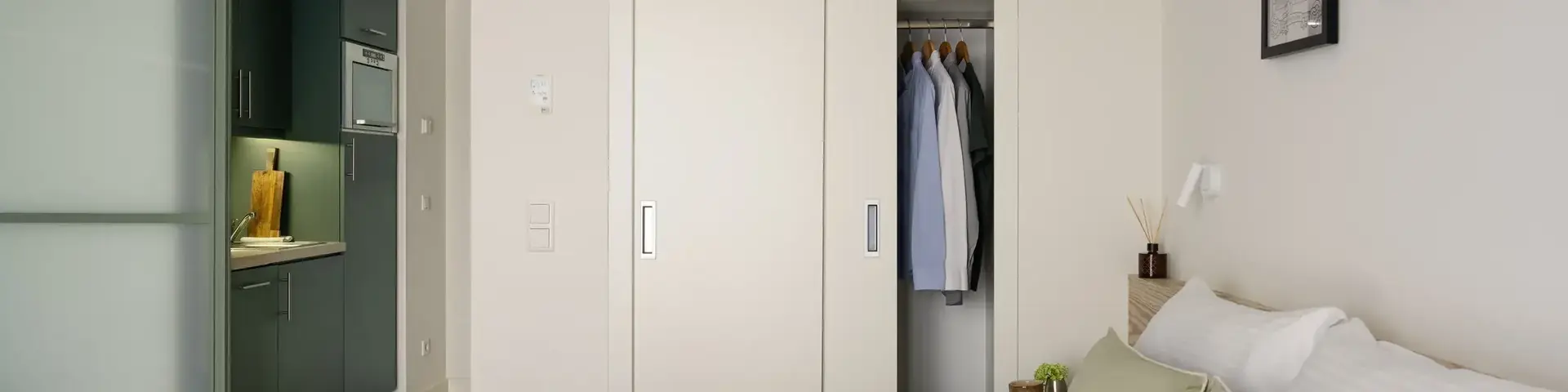 a bedroom with a closet and a bed