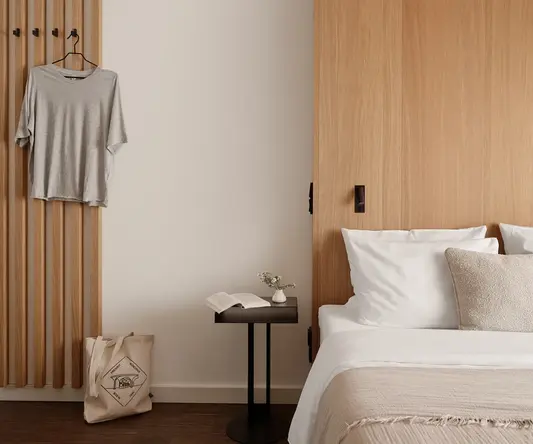 a bedroom with a bed and a table