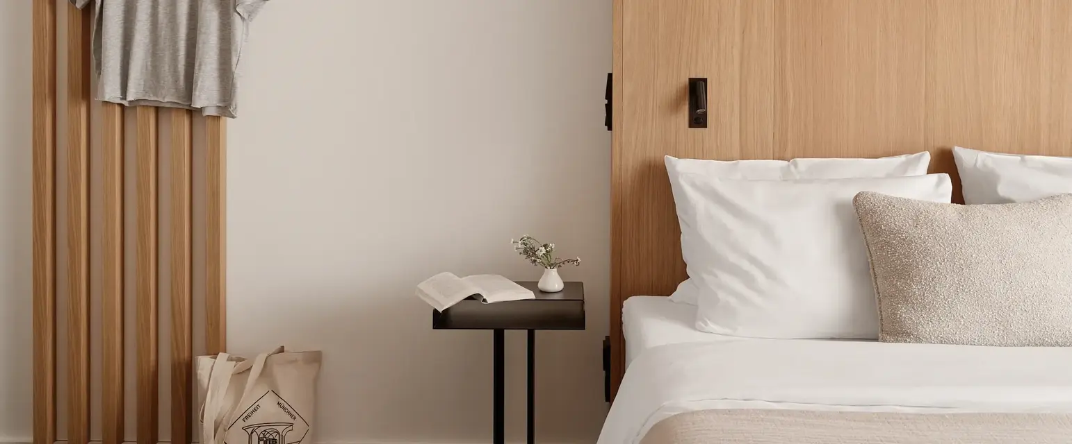 a bedroom with a bed and a table