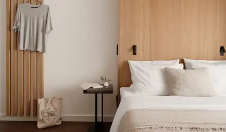 a bedroom with a bed and a table