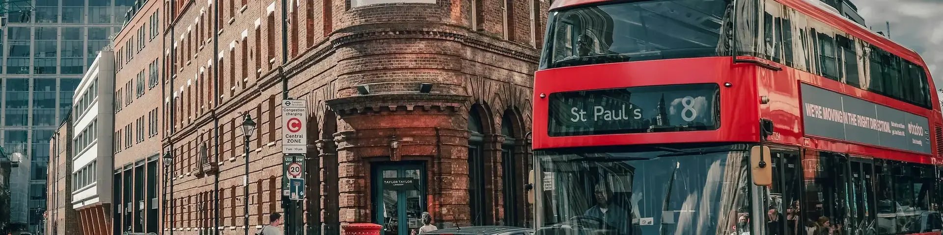a double decker bus and cars on a street