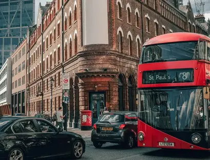 a double decker bus and cars on a street