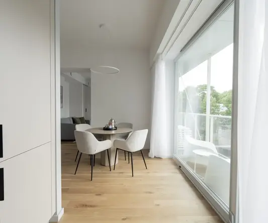 a room with a table and chairs