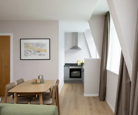 a room with a table and chairs