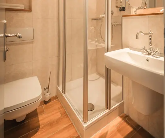 a bathroom with a shower and sink