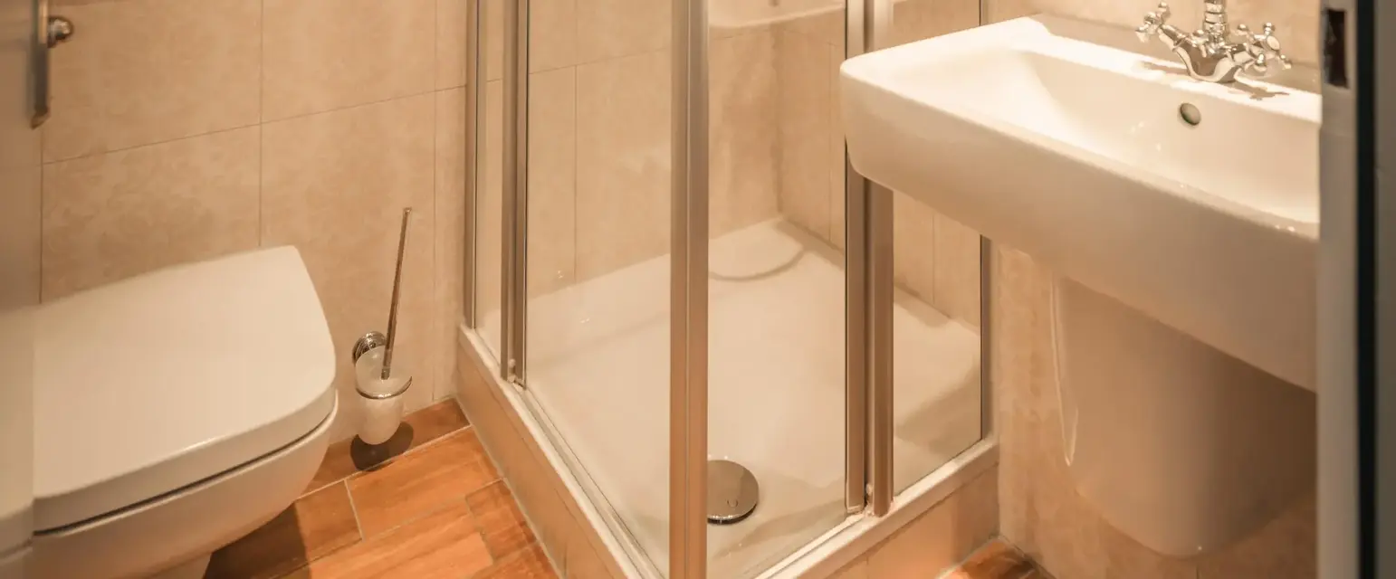 a bathroom with a shower and sink